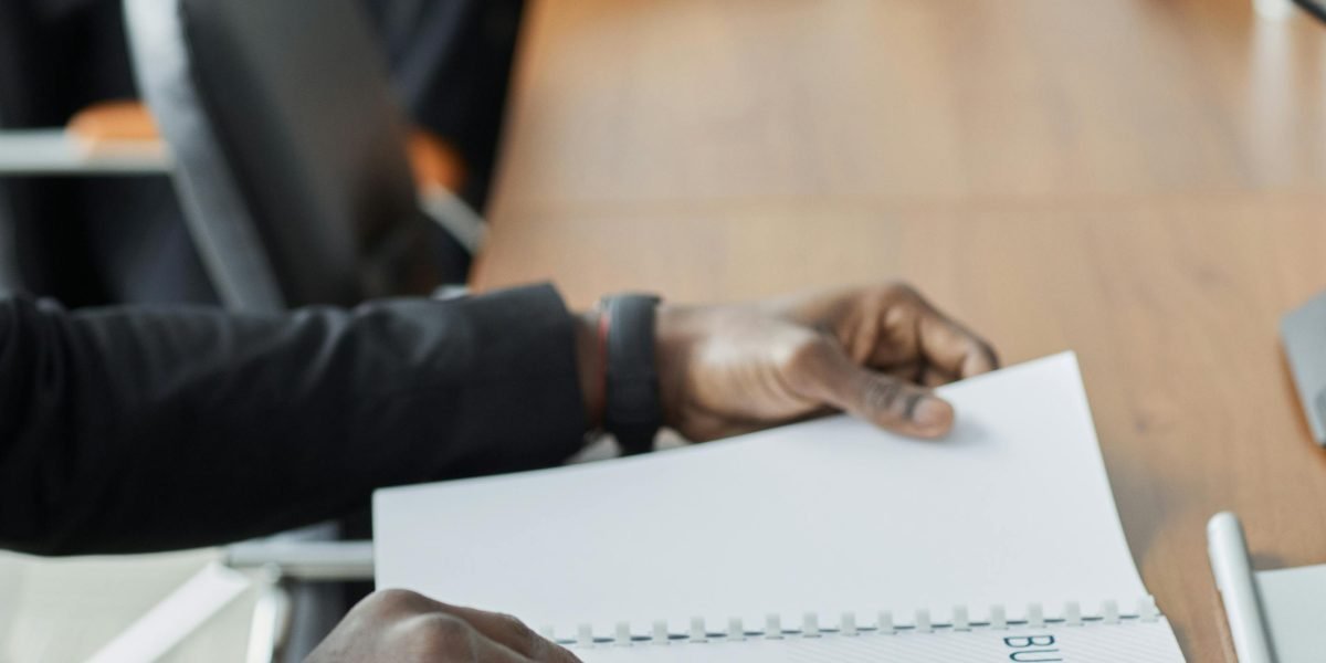 A person intently reviewing a document, symbolizing the critical thinking required to discern AI from human content.