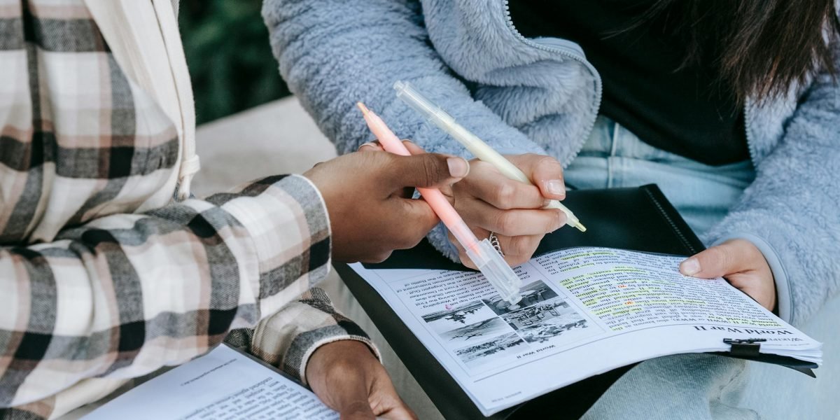 A student receiving guidance from a mentor, illustrating the process of learning and applying best practices for content creation and verification.