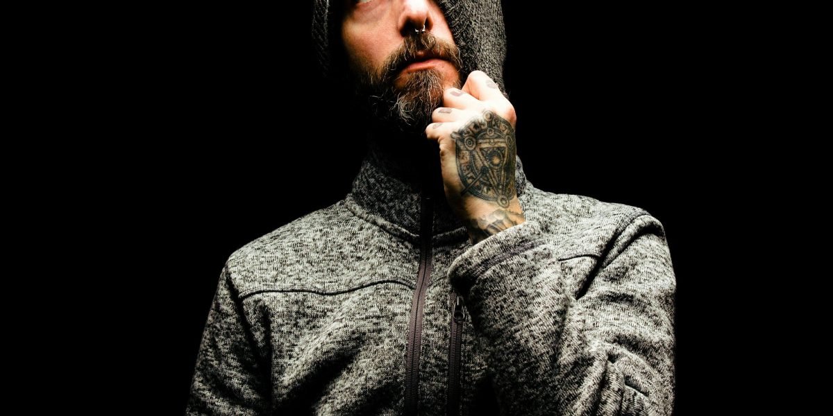 A person appears to be in deep thought, contemplating complex issues related to technology and trust.