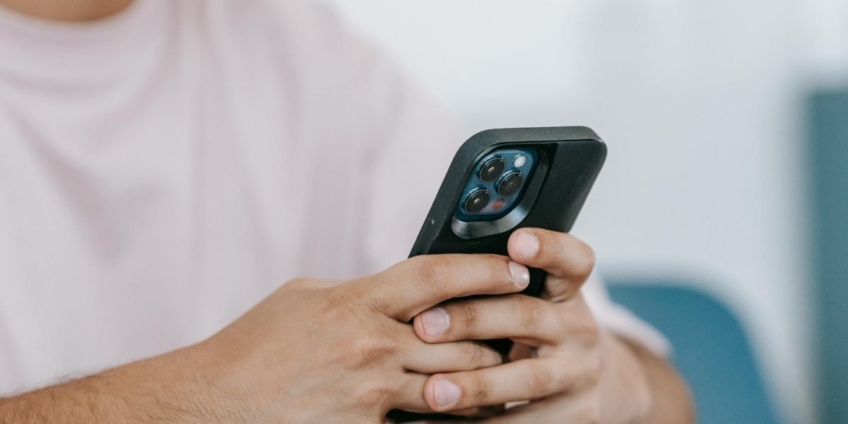 A person quickly looking up information or generating a citation using their smartphone, highlighting convenience.