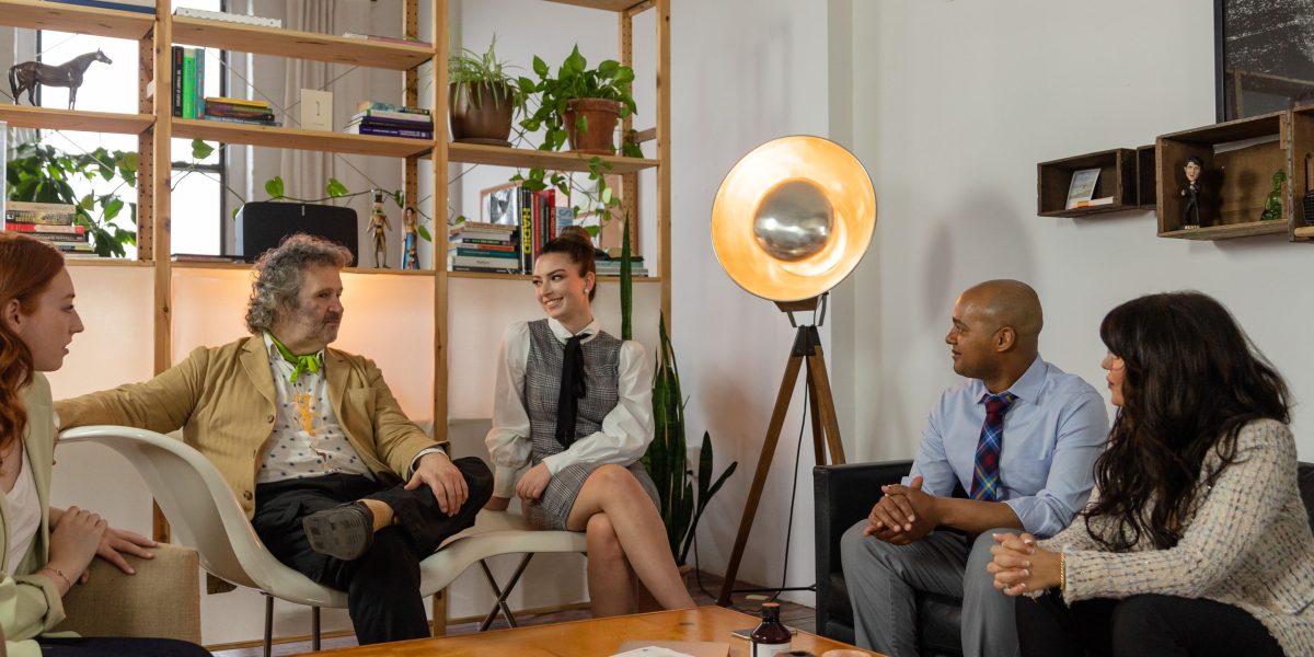 A team collaborates actively, discussing a groundbreaking strategy or new technology in a dynamic setting.