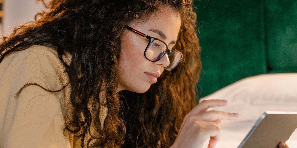 A person reflects on the authenticity of online content, pondering its human origin.