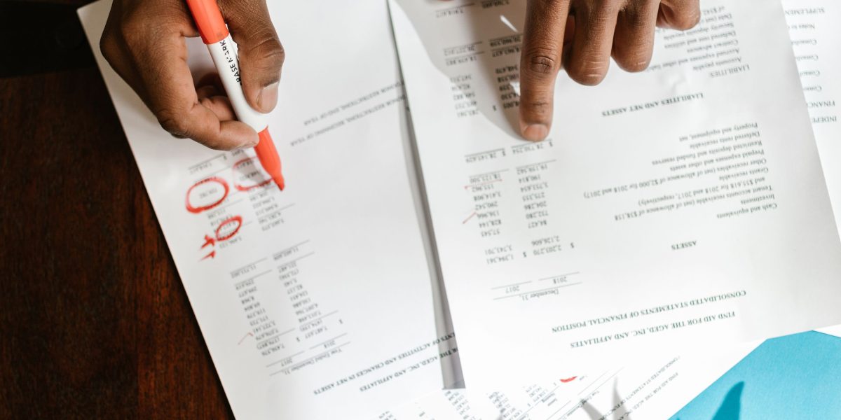A person expressing frustration or concern while reviewing a report, reflecting the impact of AI detector false positives.