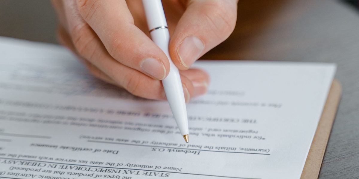 A person meticulously proofreading a document, emphasizing the need for human verification.