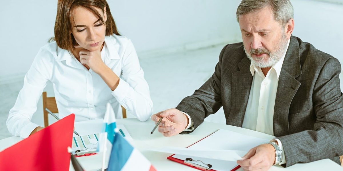 Professionals engaged in a serious discussion, highlighting the importance of policy, ethics, and clear communication when suspecting AI-generated text.