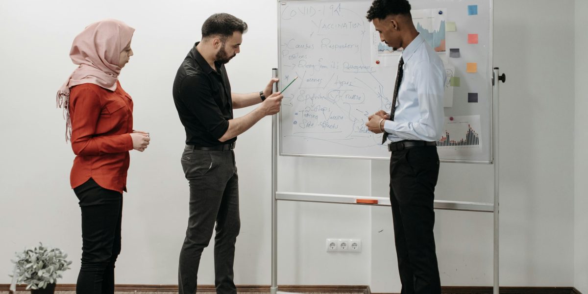 A team collaborating on a large project, illustrating the scale and complexity of managing many sources.