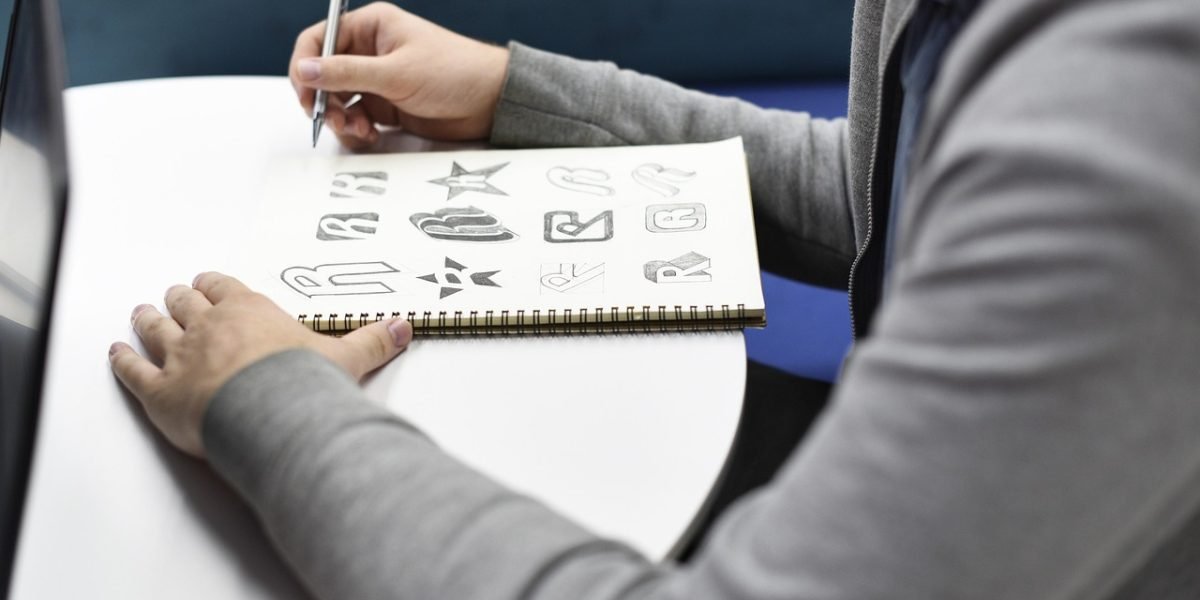 A person actively planning and envisioning a new creative project, symbolizing the initial ideation phase.