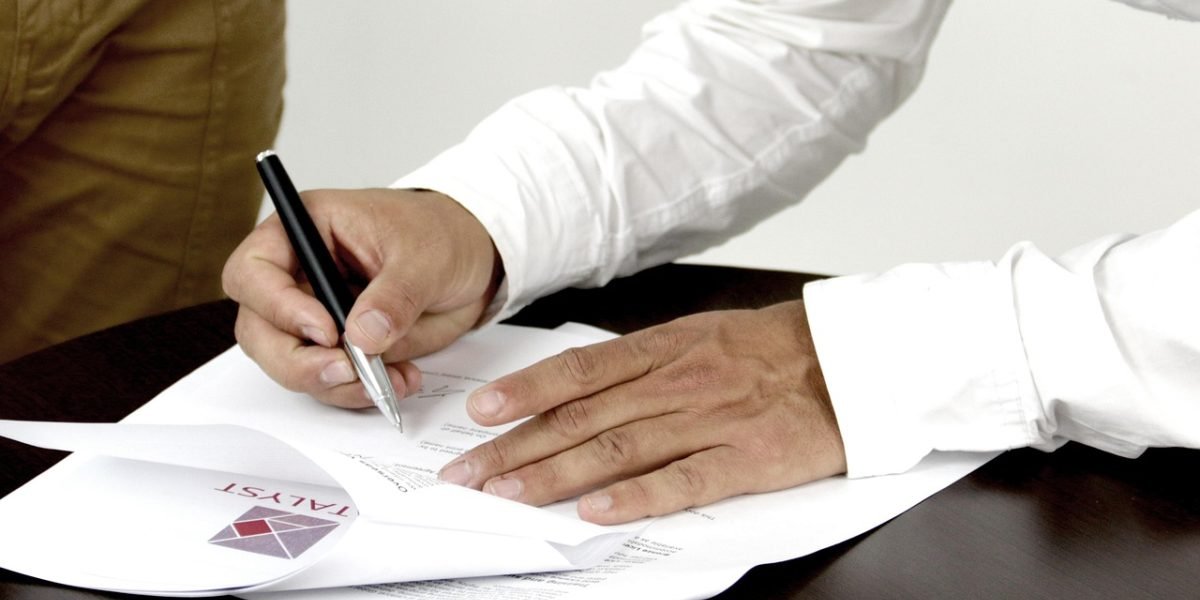 A professional critically reviewing work, highlighting the need for human oversight in ensuring quality and accuracy.