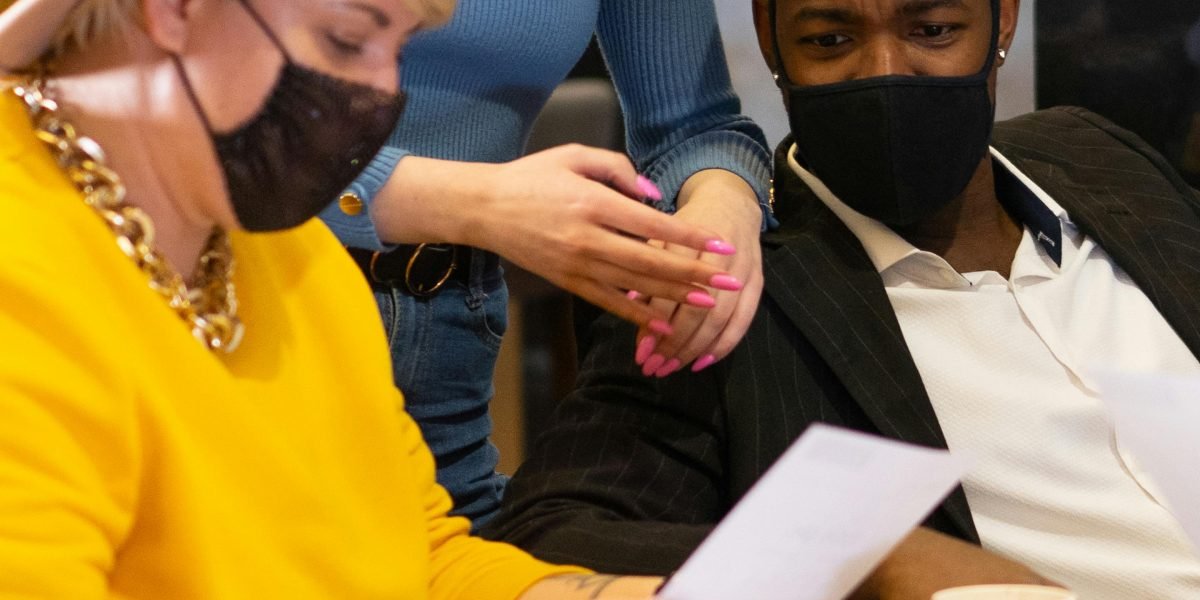 A group of professionals collaborating, representing the collective effort to establish clear guidelines for ethical AI use in educational settings.