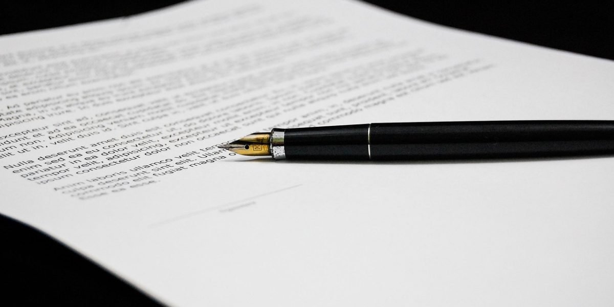A business professional meticulously reviews legal documents, symbolizing the increasing importance of AI content compliance.