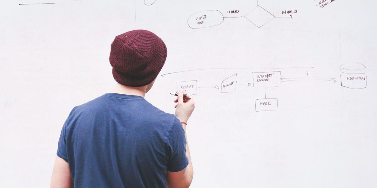 A person contemplating new ideas for AI projects, symbolizing the growing demand for AI API access.