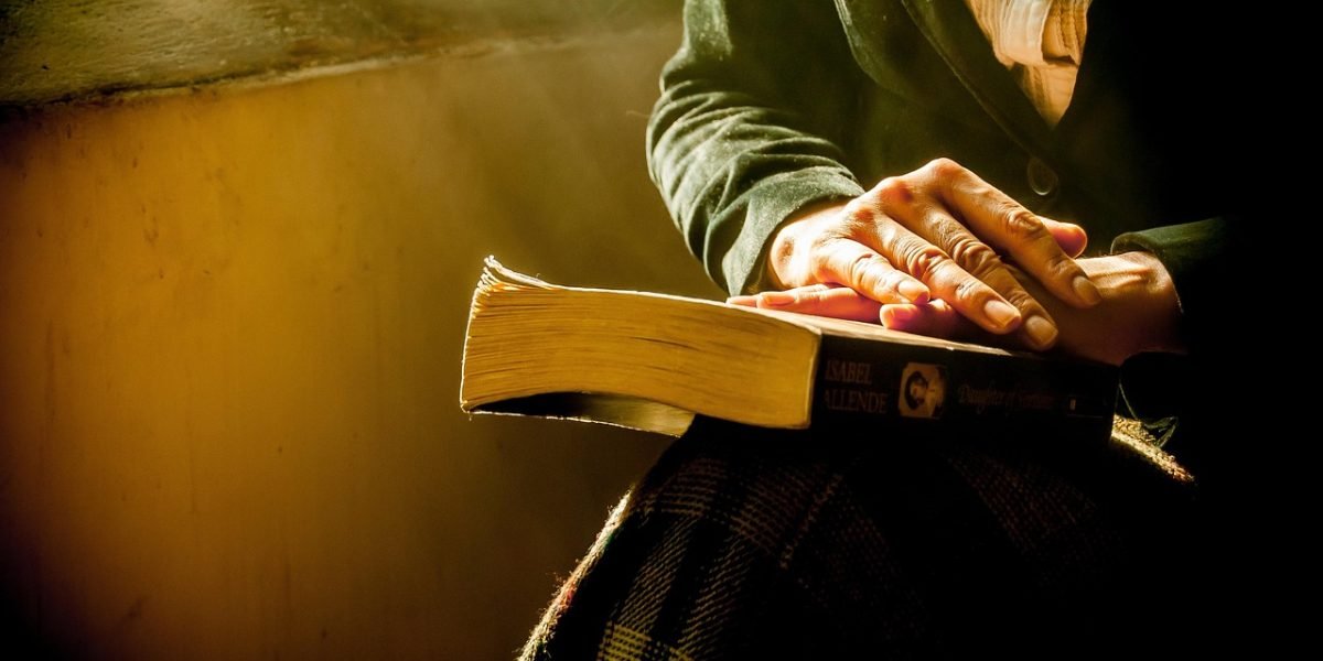A person deeply focused, scrutinizing text, symbolizing the critical need to verify content authenticity in the digital age.