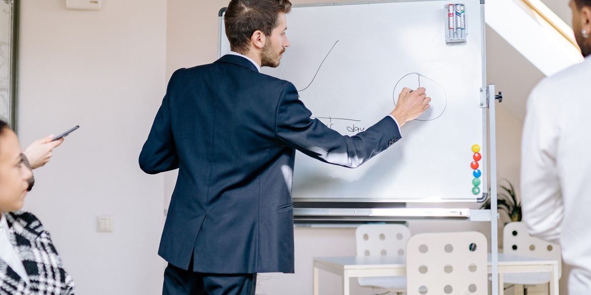 A team in a professional setting collaborates, strategizing on maintaining brand reputation and trust in the digital landscape.
