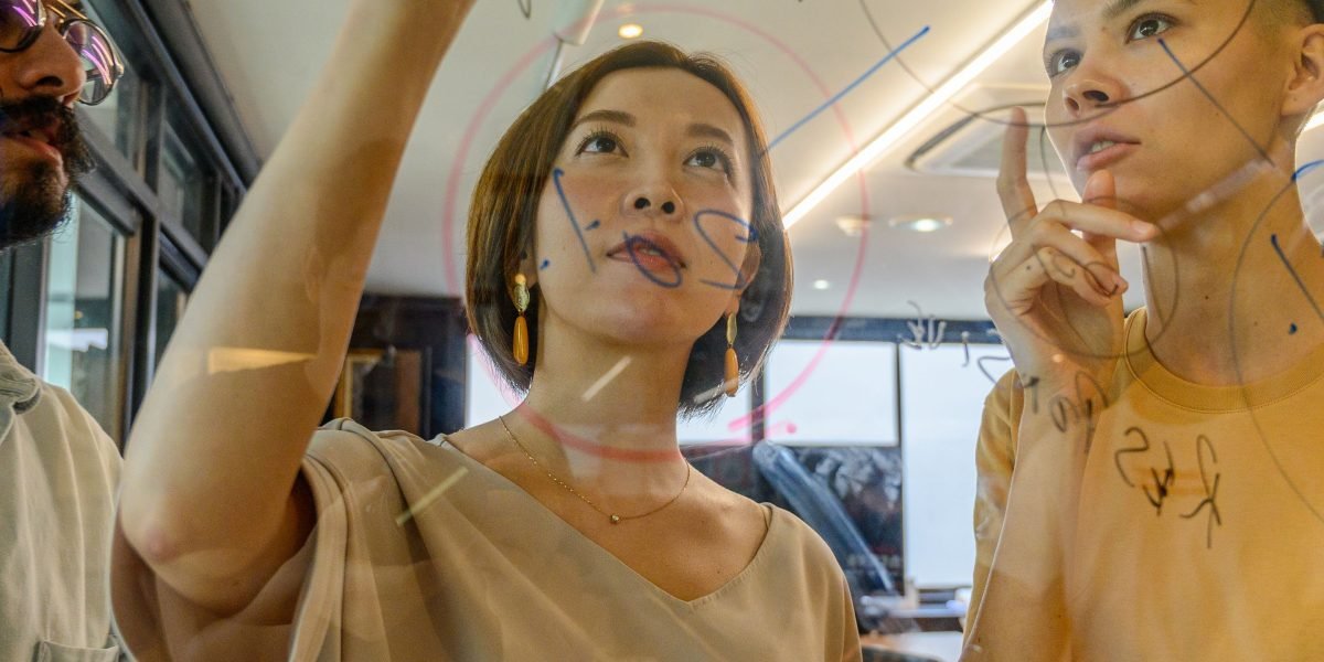 Professionals collaborating to develop solutions that build trust in AI-powered environments.